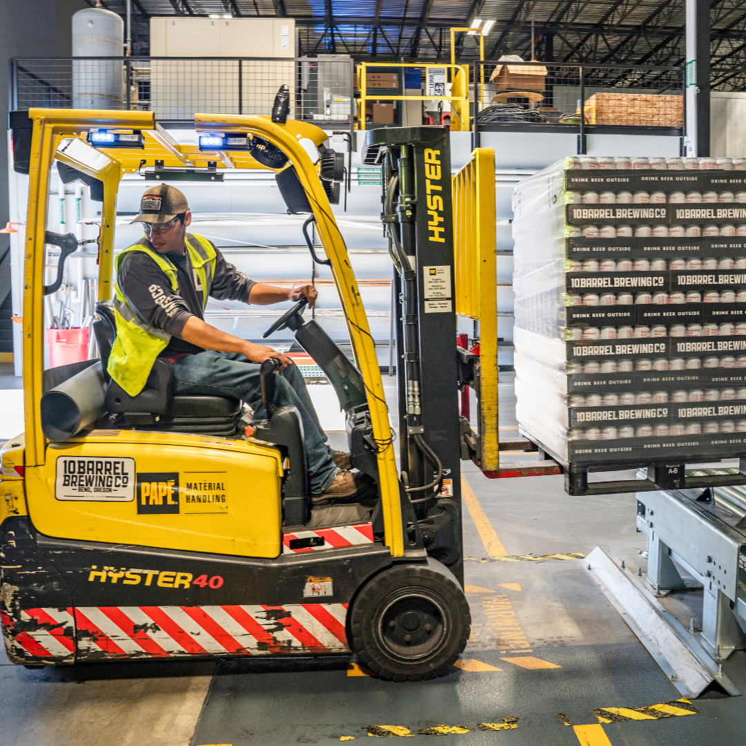 Forklift Operator moving bags of construction cement